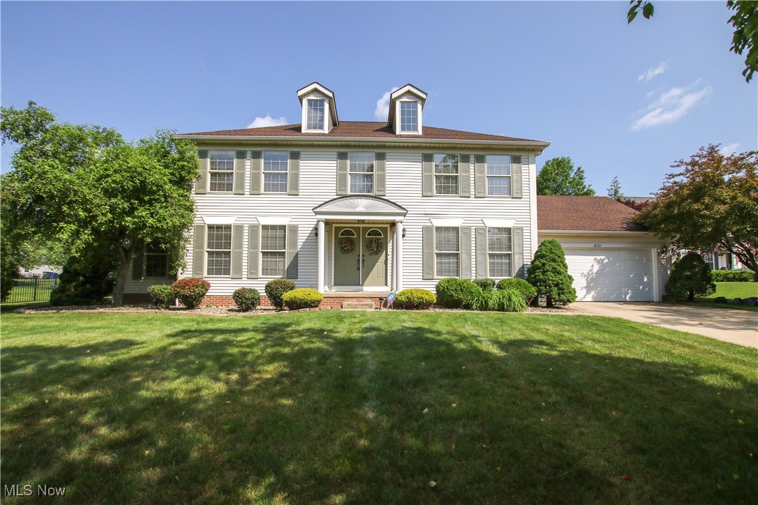 Welcome to this beautifully maintained Colonial nestled on a quiet cul-de-sac. Offering 4 spacious bedrooms and 2.5 baths across 2,592 square feet, this home features a light and neutral palette throughout. The oversized kitchen includes a large center island, ample cabinetry, and an eat-in area with access to the deck—perfect for everyday living or entertaining. The room adjacent to the kitchen features a cozy gas fireplace and opens up the main living space. French doors connect the formal living room to this area for added flexibility. A formal dining room, first-floor laundry, and a dedicated home office/den complete the main level.
Upstairs, you'll find generously sized bedrooms and a luxurious primary suite with dual closets and a large en-suite bath. The partially finished basement offers space for recreation or storage. Enjoy the outdoors in the expansive, landscaped backyard with a screened-in porch and a deck overlooking the private yard. This lovingly cared-for home offers comfort, space, and an ideal layout—all in a desirable location.