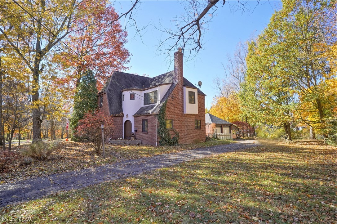 Welcome to this charming Tudor home offering three bedrooms, one and half baths. Come on into the open foyer to the large living room with fireplace and sliding door to the back patio to sit out and enjoy. Dining room with built in cabinet/hutch and kitchen. Freshly painted throughout and hardwood floors. The large kitchen has abundant of cabinets, double dishwasher, and island. There is a half bath on the first floor. Upstairs offers three bedrooms and a full bathroom. The large lower level is partially finished and has more room for storage, office, work out area etc. Partial fenced in backyard has plenty of room to entertain or just relax. There is a two-car detached garage. Close to the highways, shopping, and restaurants. Ready to move right in!