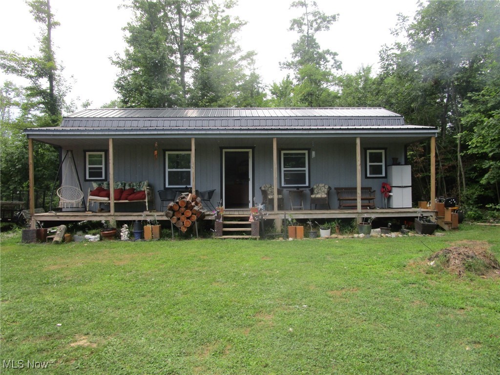Time to go OFF GRID! Don't miss this super secluded adorable 40x14 insulated retreat!Tucked back in the woods, on the edge of your pond, you'll spend endless hours enjoying the peace & quiet of your hidden hideaway.Large great room offers a kitchen area; 2 14x7 lofts provide extra sleeping space. Bedroom is 13x7; bath area 7x6.Efficient wood burning stove heats the entire place.Enjoy endless hours on the covered 40x6 porch or amble out to the 10x10 dock & do some fishing (catfish, bass, amur, blue gill).Sellers think the pond is about 8-9 feet deep.Plug for generator set up is located on the east side; 10x10 shed stores your extra tools, toys, mower & lawn furniture.Walk the trail to see TONS of wildlife here in the heavily wooded area surrounding the yard!Excluded items are any of the sellers' tools, air compressor & generator, porch furniture & cabinet, any items in the shed, couch, corner cabinet & contents in the SE corner of the great room, deer feeder & stands. Everything else stays, including the paddle boat! (Unless buyer requests that sellers remove.) What a great spot for weekend relaxation, get-togethers with friends & family - or the site of your future home!? Base for the building is wood posts set in concrete. The nights here are starry-the sun on the pond in the morning is soft & soothing-no neighbors in sight-and the sounds are the wind in the trees, the frogs & the crickets! No for sale sign-driveway is on the North side of the road, between 4275 and 4373.
