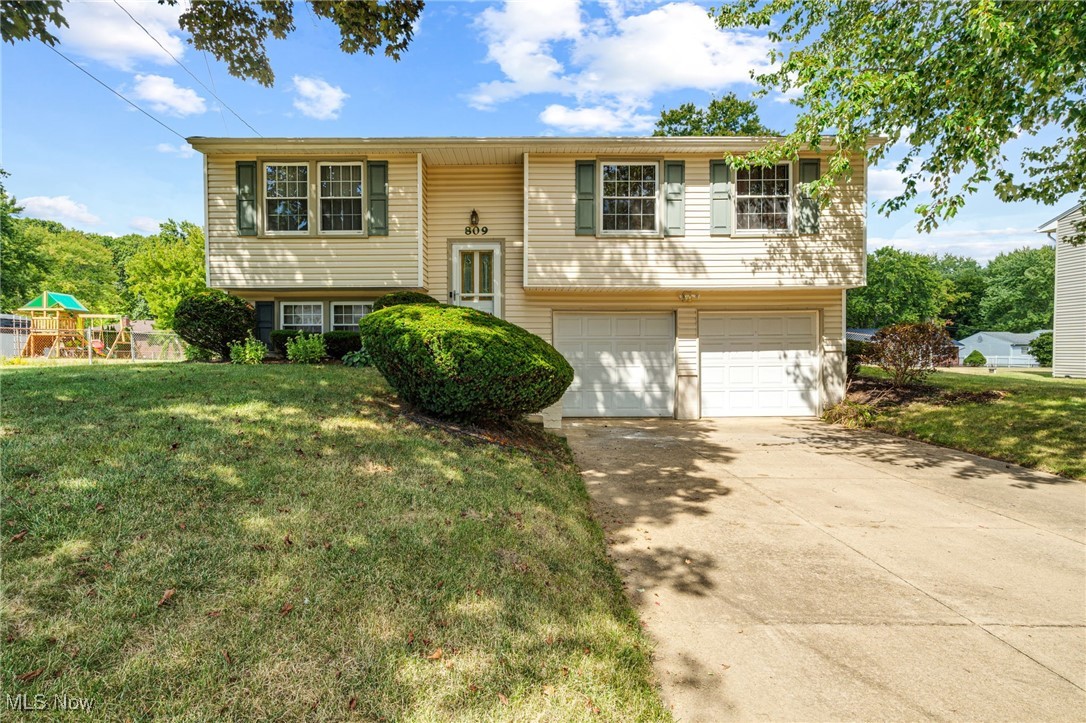 Welcome home to this wonderful property ready for a new owner. As you walk in the front door you will go upstairs to the main living area where you will find to the left a comfortable living room with carpeted floors, ceiling fan and a large window to allow plenty of natural light to come in. The dining area has ceramic floors, a sliding door to the deck overlooking the backyard. In the galley style kitchen, you will find plenty of cupboard and counter space. A full bath has been updated with a new vanity, commode and tub surround. Three bedrooms with carpeted floors and ceiling fans complete the first floor. In the lower level you can find a spacious family room with new vinyl floors, a half bath (new commode), and a utility/laundry room. The 2-car garage offers plenty of room for tools and storage. Family and friends will enjoy spending time in the fenced in back yard. There is also a shed for storage of any lawn equipment. Call today to schedule your private showing!