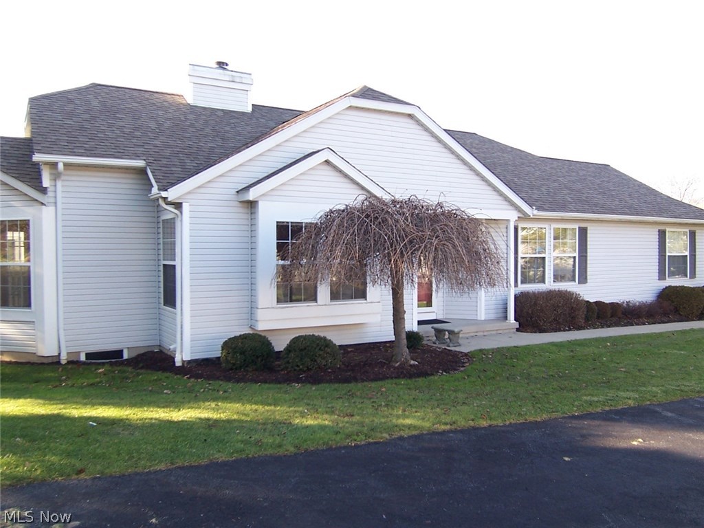 Beautifully maintained and neutral condo at popular Woodbury! It is an expanded Ashley, adding two additional feet to the whole width of the unit including the garage! The Foyer entry leads to the vaulted living room with a gas fireplace and a formal dining area. The kitchen boasts white cabinets, Brazilian cherry wood floors, and a breakfast bar. There is a beautiful newer deck accessed from the dining area. The vaulted master bedroom is very spacious accommodating king-size furniture and includes a sitting area. There are two closets - one of them a walk-in closet! The master bath is very spacious and includes a newer commode. The 2nd bedroom is also very large, and the main bath is just across the hall making it a perfect guest bedroom! There is a 1st floor laundry with a closet and laundry sink. The huge unfinished basement, plumbed for a bath, could be finished with much additional living space, and great storage! The H2O was replaced in 2015. This condo is close to shopping, rest