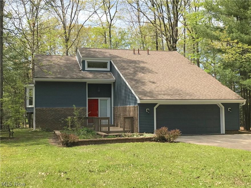 Multi-level contemporary home with two living areas. Some of the updates the current owner has done are a new roof, new AC Unit, new flooring through (hardwood on main level, ceramic tile on lower level), freshly painted, and brand new steps down to the water and dock area. With two kitchens, this home can easily house two separate families at the same time or you could make a fully functioning in-law suite. Main floor boasts wonderful views from the elevated deck overlooking the backyard and cove close to your dock and boat. The Master suite has doorway out to the deck providing both views and a Summer night's breeze. Master bath sectioned for double use and privacy with a walk-in closet. Formal dining area, Living Room with vaulted ceiling, Kitchen has it's own eating area for a table and a walk-out to the elevated deck. Also a half bath is on this level. The Lower level has an efficiency kitchen, a Family room with a direct vent/free-standing stove with propane hookup, and a doorway