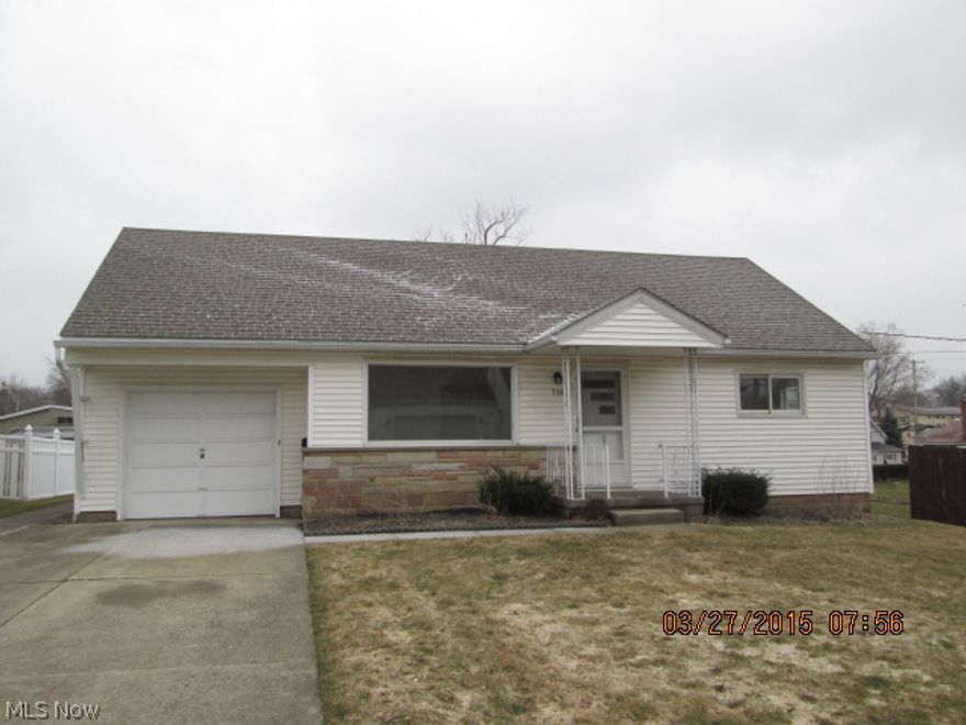 4 bedroom bungalow with a full and half bath with newer vinyl siding & replacement windows.