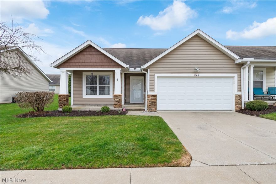 Welcome to this charming two bedroom ranch condo located in Lakemore's desirable Brittany Commons development.  This inviting abode boasts an open floor plan.  The great room has vaulted ceilings and opens to the dining room and kitchen.  The kitchen has oak cabinetry, stainless steel appliances and ceramic tile flooring.  There are two spacious bedrooms and two full baths.  The primary bedroom has a large walk in closet.  The laundry room is situated on the main floor.  Enjoy summer evenings on the patio.  This is an end unit.  All of this, plus a two car attached garage.  Enjoy the convenience of condo living with year round exterior maintenance, allowing you to live with ease and peace of mind.  This unit is move in ready and awaiting a new owner.  Call to schedule a showing today to make this your new address!!