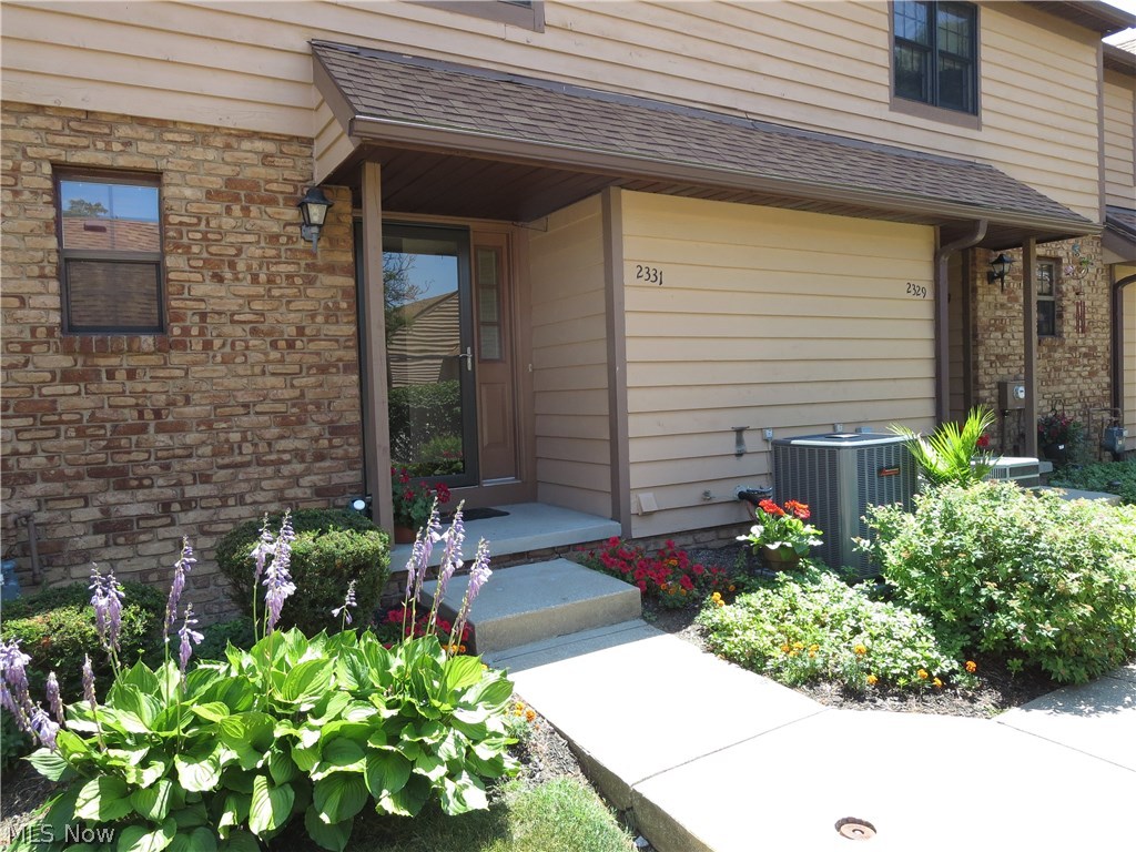 It’ll be stunning views from every living area of this handsome 2 bedroom, 2.5 bath townhouse condo, right on the Riverfront in Cuyahoga Falls! Tucked away from traffic, and perfectly-placed, you can walk to restaurants, the Natatorium, the library, take river walks, walk to the grocery and enjoy all of the festivities on the Riverfront. You’ll love the kitchen, conveniently-open to the dining room, and the living room with a corner fireplace. You’ll appreciate having the convenience of 1st floor laundry, the 18 x 18 lower-level family room with the walk-out, and full bath on that level! You’ve never seen so many updates, either. The furnace, air conditioning, water heater, refrigerator, built-in microwave and dishwasher are all brand new. The master suite features not only a full bath, but an adjacent dressing area with an additional lav and walk-in closet! Off the bedroom is an upstairs deck overlooking lovely trees and a lush green space. In fact, this is the only unit with a walk-o