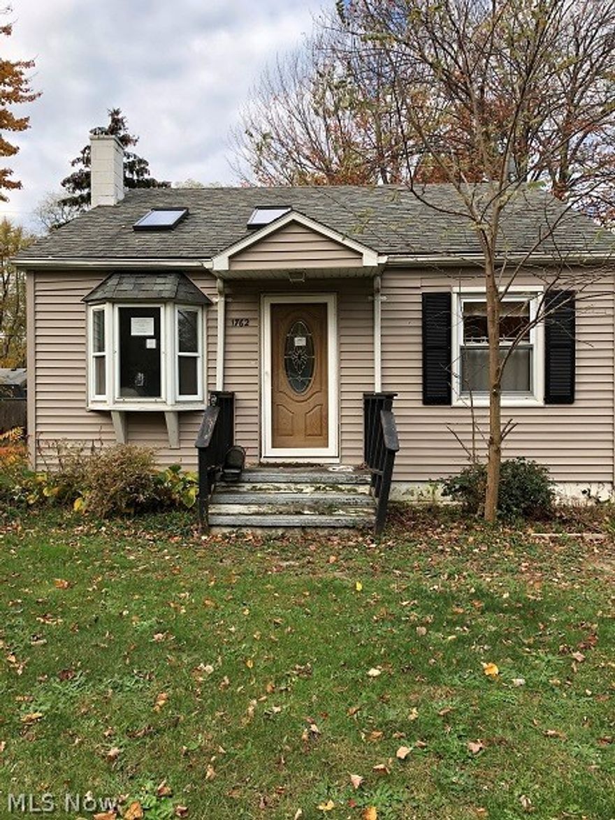 Cute 2 Bedroom, 2 Bath Home With eat in Kitchen, Hardwood Floors a Basement on two lots