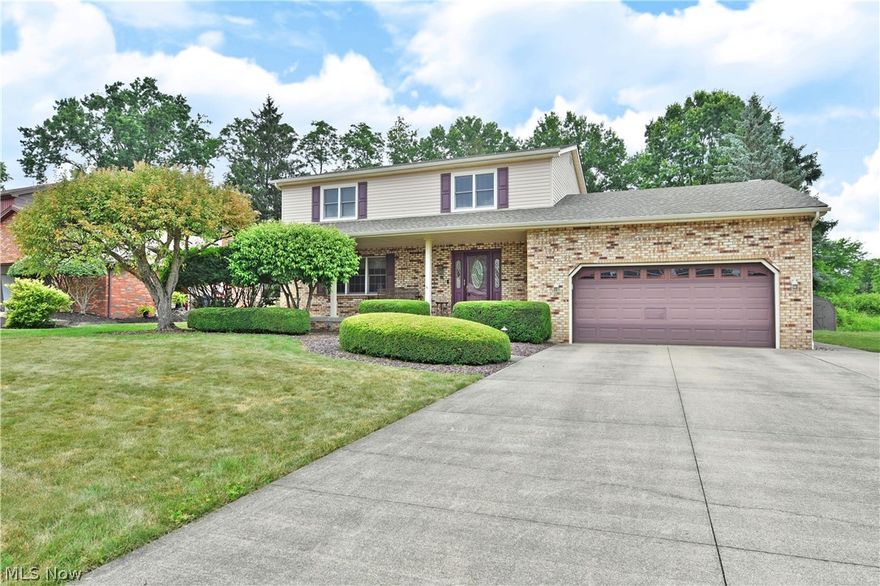 Welcome home to three floors of gorgeous living space with this 5 potential bedroom Niles home! Nested deeply into a desirable neighborhood, this location puts you minutes from shopping and schools. A concrete drive leads up the perfectly manicured home with its shapely landscaping and tasteful brickwork that offsets the covered front porch. Around back, a prominent deck enjoys park-like views. Inside, the generous foyer awaits past the decorative entry door as elegant, tiled-like flooring spills past the main stairway and half bath, leading into the must-see kitchen. A welcoming living room sweeps around nearby w/ gorgeous hardwood-like floors & a trio of picture windows that help illuminate the nearby formal dining room. The central kitchen brings tasteful aesthetics with recessed lighting shining down upon the wrapping countertops. Updated appliances join the huge pantry while eat-in dining graces the far wall. An oversized family room with a cobblestone fireplace and deck entry com