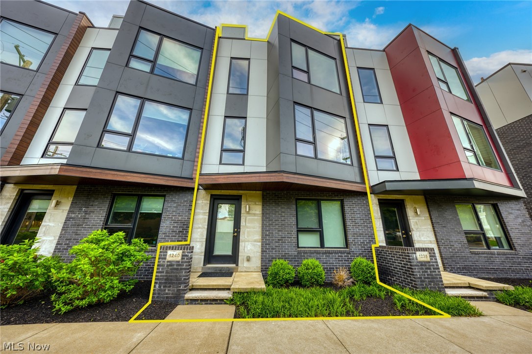 TOWNHOME FOR RENT IN BATTERY PARK with VIEWS of downtown Cleveland and Lake Erie! Experience living in one of the most recently completed phases of sought after Battery Park!! Over 1,800 square feet of beautiful living space and amenities! Enter through either the front door or the 2-car attached garage and find a first floor spacious bonus room. This can be used as a workout room, bedroom or office. The second floor features an open-concept layout with plenty of natural light from numerous windows with automated Hunter Douglas blinds. Kitchen includes high-end stainless steel appliances, quartz countertops, and hardwood floors. This townhome has a multitude of builder upgrades including a modern gas fireplace that centers the living room. Third floor large guest bedroom and bath, laundry space and owner's suite - both with custom California Closets systems. Owner's bedroom has a spacious walk-in closet and a spa-like bathroom. ROOFTOP PRIVATE TERRACE with SPECTACULAR views of Cleveland and Lake Erie - entrance via doorway with a wet bar. Patio furniture and fire pit are included. Close to the beach (Edgewater Park), Gordon Square and nightlight and restaurants and a 5 min drive to Downtown Cleveland. Try out lakeside living at its finest.