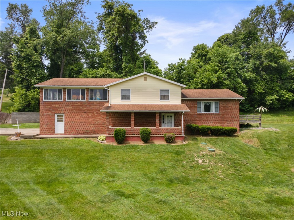 Welcome to 53979 Colerain Pike! This spacious home offers 4 bedrooms and 2 full bathroom, situated on approximately 1.5 acres. Upon entry, you'll be welcomed by a covered front porch. Just inside, there's a versatile room to the left that can be used as a bedroom, office, rec room, or for additional storage. Upstairs, the main living area features a kitchen, dining room, and a living room that flows seamlessly together. The upper level also includes three bedrooms with generously sized closets and two full bathrooms - one of which is located in the master bedroom. The attached garage comfortably fits two vehicles, with additional space that can accommodate a third car. The large yard provides plenty of room for entertaining guests. The basement includes washer and dryer hookups and offers ample storage space. Conveniently located near Martins Ferry School. Schedule your showing today to see everything this home has to offer!