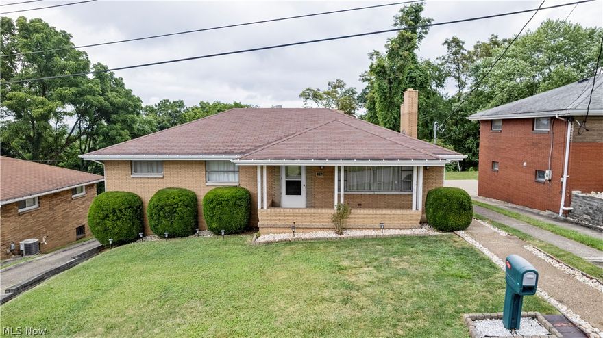 BEAUTIFUL 4 BED/2.5 BATH *SOLID BRICK RANCH HOME* WITH 3 CAR GARAGE FOR SALE ON WEIRTON HEIGHTS! Welcome HOME - Where you are welcomed by a Nicely Sized Covered Front Porch, Perfect for Unwinding after a long day to enjoy the Evening's Fabulous Sunset! Immediately upon entering the Home, you are Greeted by a Large Sit-In Living Room that Boasts Tons of Natural Light and Stunning LVP Floors that Flow throughout the Heart of the Home! Find a Nicely Remodeled Bath with Ceramic Tile Floors, Elegant Wainscoting, a Large Linen Closet, Tub/Shower Combo, Oversized Vanity with Medicine Cabinet! Wonder through to the Dining Area perfect for Hosting a Dinner Party nestled just off a Kitchen made perfect for the True Chef at Heart - Having Tons of Counter-Top and Cabinet Space. Ease into the Grand Family Room that has a Built-In Stone Gas Fireplace, Vaulted Ceilings, Elegant Chandeliers and Fixtures with Dimming Options along with Windows End-to-End Presenting Fantastic Views! As your day draws to a close, Find yourself retiring to an Enormously Sized Main Bedroom having a Wall-to-Wall closet, a Large Window that Encapsulates Amazing Treelined Views and Capture the Morning Sunrise as you begin the proceeding day!  On top of that - The Main Bedroom also has an Updated Bath with Ceramic Wall-Tiles and Flooring through-out, a Walk-In Shower for Ease of Access, Ample Storage Space and Nicely Done Upgraded Fixtures.  Other Bedrooms offer Great use of Space that is Brightly Lit also with lots of storage! When the weekend strikes - Find yourself Lounging Back in the Rec-Room which Boasts a Built-In Dry Bar, an All-Brick Fireplace with a Built-In Brick Oven - Perfect for Quality Time spent with Quality People who matter most to you! Last but not least - Enjoy the perks of having not 1, but 3 Covered Garage Spaces. One being a Deep Single Car Garage and the other being a Large 2 Car with a Workshop Space Attached - Along with ample on/off street parking for guests! Don't wait, call now!