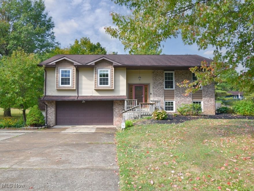 Welcome to this spacious and well-maintained (almost 2200 sq. ft.) 4-bedroom home that blends comfort, functionality, and room to grow. The master suite offers a private en-suite bathroom and generous storage, while the additional bedrooms provide flexibility for family, guests, or office space. The open and airy kitchen with a breakfast bar is perfect for casual dining or entertaining, and all appliances stay to make your move-in seamless. Enjoy every season in the cozy 3-season sunroom or relax outdoors on the deck—already equipped with a hookup for a hot tub—or the patio, which features a built-in playhouse and sandbox under the enclosure. This home sits on a total of .55 acres, thanks to the included bonus lot, providing even more outdoor space and potential. Two storage sheds, one 8x10 and the other 10x16, offer plenty of room for tools, toys, and hobbies, while the garage includes a workshop area and convenient direct access to the laundry and half bath. Upstairs, new vinyl flooring adds a fresh touch throughout. A privacy fence surrounds the outdoor living areas, extra parking accommodates guests, RVs, or recreational vehicles, and a Ring Security System with no monthly contract offers peace of mind. With its practical layout, thoughtful updates, and abundant amenities inside and out, this home is truly move-in ready and designed to meet all your needs.