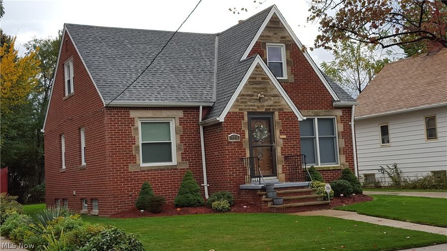 Gorgeous remodeling! New kitchen counter top, cabinets, flooring, lighting and NEW range and refrigerator!  New bathroom floor, sink, toilet, glass block window!  Enclosed rear sun porch!  New front door with leaded glass in foyer!  Natural woodwork and hardwood floors on first and second floor!  New vinyl windows!  New roof!  New glass block basement windows!  New 100 amp breaker box! New hot water tank!  Newer furnace!  New hall way and basement step vinyl floor covering! Two car garage!  NOTHING TO DO BUT MOVE IN!!!