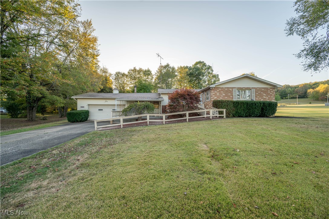 Welcome to your chance at country living with room to spread out. This spacious ranch offers nearly 1,900 square feet on the main floor, plus a partially finished basement that feels like your own throwback game lounge, complete with a fireplace and space for a pool table. The main level features three bedrooms, one and a half baths, and a laundry area right where you want it — on the first floor. The living room is light-filled and roomy, while the den brings vintage charm with its paneling and cozy wall heater. Step into the kitchen and dining space with plenty of cabinets and counter space. The oversized bathroom is larger than you’d expect, and the bedrooms come with character touches like cedar-lined closets and a half bath. Downstairs, you’ll find bonus rooms, a utility area, and plenty of storage to keep life organized.Outside, the property sits on just under an acre with an attached two-car garage, a barn, and a gazebo ready for summer evenings or fall bonfires. A brand-new septic system is being installed, giving peace of mind to the next owner. The home is solid and well cared for, waiting for you to bring your own style and updates to make it shine.
You’ll enjoy small-town charm while staying connected to nearby routes. Don’t miss your chance to make this one yours.
