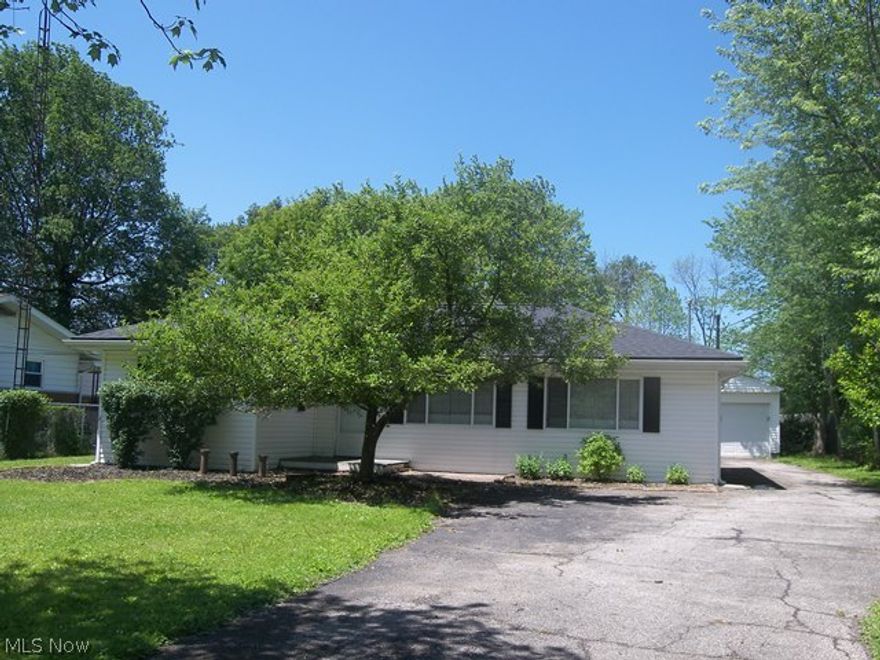 No Steps!  Sharp, updated ranch in move in condition!  Come see this great opportunity for a move in condition ranch close to everything!  Open living room and family room with newer carpet.  The family room offers an electric fireplace with wood mantle surround.  The spacious and open kitchen and dining room have nice hardwood flooring.  The updated kitchen has ample cabinet and counter space and includes the dishwasher, range and fridge.  There are three bedrooms and an updated full bath.  First floor laundry.   There is great storage in the attic.  The yard is fantastic!  The backyard is a nice, spacious flat yard with a newer two car detached garage.  The house has a newer roof (12/14) and offers maintenance free vinyl siding.  Current owner added blown in insulation. The washer and dryer are also included.