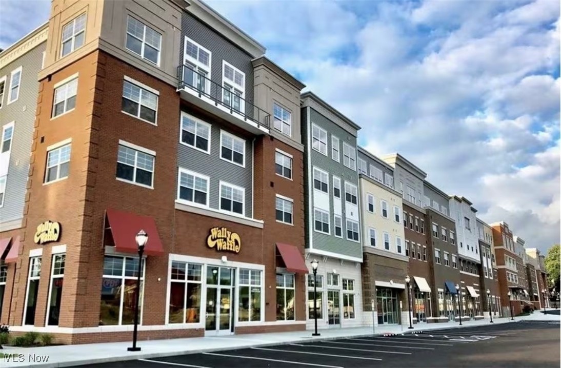 This 1-bedroom, 1-bath apartment is conveniently located just off Tallmadge Circle. It features an open living and kitchen area with modern finishes, a private balcony for outdoor space, and the convenience of an in-unit washer and dryer. The bedroom includes a spacious walk-in closet, providing plenty of storage. A comfortable and well-appointed living space in a central location.