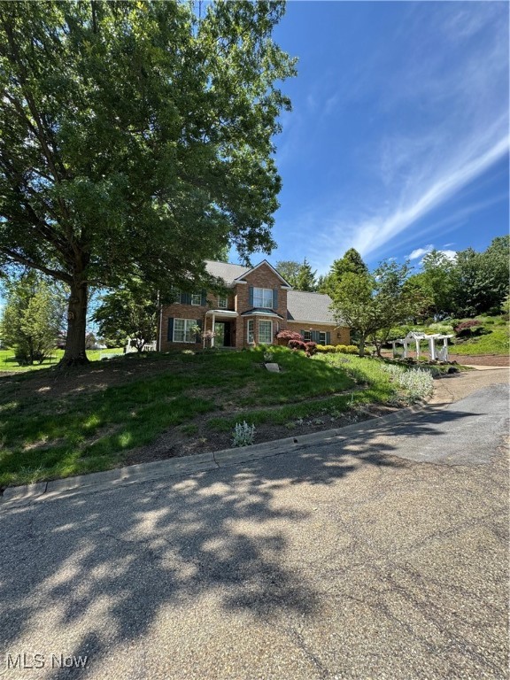 STUNNING IS WHAT I SAY! THIS TRADITIONAL HOME IS AMAZING WITH BEAUTIFUL FEATURES YOU WILL OBVIOUSLY LOVE. THIS HOME OWNER LOVED HER OUTDOOR AREAS, BEAUTIFUL ARBORS, PERENNIALS, TREES, LIGHTED RETAINING WALL AND EVEN A POTTING SHED! A PATH TO WIND YOUR WAY UP TO LOOK DOWN AT THE BEAUTIFUL YARD. THIS IS ON ALMOST HALF ACRE AND IT IS RIGHT IN THE CITY LIMITS! PRIVATE FEEL IN THE CUL DE SAC HARD TO BELIEVE YOU ARE SO NEAR ALL THE AMENITIES BUT YOU HAVE THE FEEL OF BEING OUT OF TOWN. THE HOME HAS WONDERFUL FEATURES NATURAL HARDWOOD FLOORS , LOADS OF WINDOWS FOR LIGHT, CAMBRIA QUARTZ COUNTERTOPS IN THE EAT IN KITCHEN, CUSTOM CABINETS WITH LIGHTING AND SOME GLASS. ALL APPLIANCES WILL STAY. WE HAVE A FOYER, FORMAL DINING ROOM, FORMAL LIVING ROOM, GREAT ROOM WITH FIREPLACE, SUNROOM THAT LEADS OUTSIDE TO ALL THE BEAUTIFUL MAGIC HAPPENING. A TWO CAR OVERSIZED GARAGE WITH WINDOWS! STORAGE! FROM THE DINING ROOM TAKE THE STAIRS TO THE UPPER LEVEL AND HAVE AN ABUNDANCE OF SPACE. THREE OR FOUR BEDROOMS YOUR CHOICE THIS XTRA ROOM COULD BE A VERSATILE ROOM FOR EXERCISE OR MOVIE ROOM OR ANOTHER GAME ROOM. ALL THE ROOMS HAVE SOLID HARDWOOD FLOORS. VERY NICE! THE BASEMENT HAS THE LAUNDRY ROOM, A STORAGE ROOM AN OPEN AREA WITH BUILT IN SPACES FOR THE FULL SIZED REFRIGERATOR AND FREEZER THESE APPLIANCES WILL ALSO STAY WITH THE HOME. THIS BASEMENT ALSO HAS AN EXIT DOOR WITH STEPS LEADING UP TO THE BACKYARD. VERY CONVIENIENT!