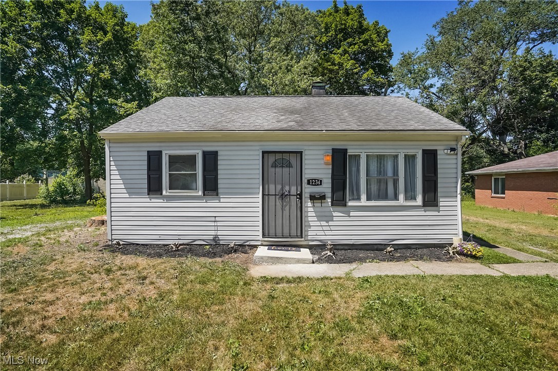 Welcome to this charming 2-bedroom, 1-bath ranch with detached 1-car garage nestled on Akron's west side! This adorable home features a smart, efficient layout with a spacious living room, cozy kitchen, and two comfortably sized bedrooms. Enjoy a huge backyard perfect for relaxing, entertaining, or future possibilities! Enjoy quick access to I-77, Route 18, and just minutes from Highland Square, Fairlawn, and Downtown Akron. Perfect for investors looking for an easy-to-maintain property with strong rental potential. Roof less than 10 years, furnace less than 4 years, brand new central air unit, all new flooring, updated kitchen and bathroom. The utility room adds extra function, and the layout offers flexibility for updates or personalization. Don’t miss this excellent opportunity to own a well-located home with convenience, value, and potential! Selling As-Is – All offers must include proof of funds or a pre-qualification letter.