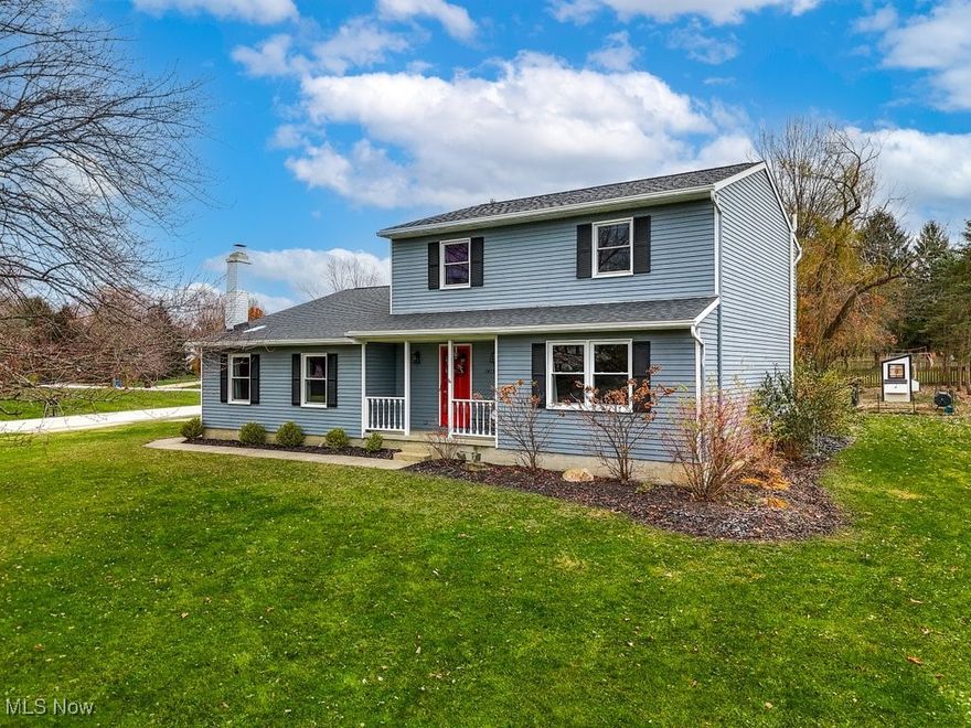 Your opportunity to move to Hudson has arrived! This center hall colonial is move-in ready with many updates throughout- LVT flooring and carpet, remodeled kitchen (2021) with stainless steel appliances, reverse osmosis system and granite countertops, new windows and patio door (2021-2024), HVAC (2018), roof (2019), well pump/water softener (2024), sump pump (2018). The main floor features a step-down family room with a charming gas log fireplace, a large living room, a private office, laundry room and a remodeled kitchen that opens to the dining area. Upstairs are 3 bedrooms, including a roomy primary bedroom with a walk-in closet, and a spacious bathroom with a double sink and linen closet. The partially finished basement offers additional living space and ample storage. The charming front porch and spacious deck overlook 0.60 acres of yard with mature trees and beautiful plantings. This lovely home is ideally located within a mile of Colony Park and Barlow Farms Park and is a quick drive to Ellsworth Meadows Golf Course. A sidewalk, steps from this home, safely connects you to downtown Hudson. And, you don't even have to leave your driveway to watch the Hudson 4th of July fireworks!  Ring in 2025 in this lovely Hudson home!