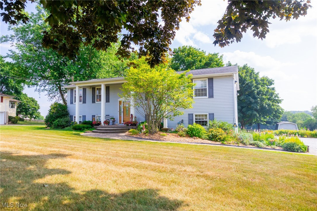 Set on 0.69 acres along a quiet street in Kidron, Ohio, this raised ranch combines country views with the convenience of being close to town, and it’s located in the Dalton Local School District. Thoughtfully maintained by its owners, the home offers 4 bedrooms, 3 bathrooms, and a layout designed for comfortable family living.
The exterior was fully updated in 2010 with a new roof, siding, and poly deck that overlooks the backyard. The driveway has fresh limestone with plenty of parking space for guests. An attached, heated, and insulated 2-car garage includes cabinetry for storage and a workbench. Recent mechanical updates include a natural gas water heater (2021), a new well pump (2022), and a private well with water softener and pH conditioner. The home is served by natural gas forced-air heat and central air.
Inside, the main level features a spacious living room, dining room with patio doors to the deck, and a functional kitchen with abundant cabinetry, pull-outs, and a breakfast nook overlooking the backyard (nook furniture can transfer with the sale). The master suite offers its own bathroom, while two additional bedrooms share a hall bath.
The lower level includes a large family room, laundry, a fourth bedroom, and a third full bathroom, along with direct access to the garage. Abundant closet and storage space can be found throughout the home.
This property offers a great opportunity to purchase a well-cared-for home in a desirable location.