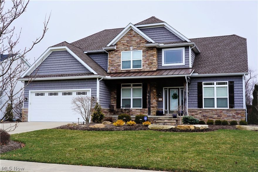 Every detail was carefully selected and masterfully incorporated in this 5 bedroom, 4 full bath craftsman style home in the tranquil Creekstone neighborhood. Custom built with up-to-date finishes including hardwood floors, stone countertops, stone gas fireplace, vaulted 2 story great room and 10 feet ceilings, high-end Whitmer lighting and Moen plumbing fixtures, sold wood doors and crown moldings everywhere. Chef's kitchen has an ample supply of beautiful soft touch cabinets, new stainless Kitchen Aid appliances, large island pantry & great flow. Spacious master suite w/luxury bath & giant walk in closet makes a great retreat. 1st floor office & convenient laundry. Additional 1,250 sq ft of entertaining space boasts a home theater, soapstone bar & gaming area. Serene backyard featuring a built-in gas fire pit overlooking low maintenance inground 33'x16' fiberglass pool w/waterfall, built-in gas grill & privacy fence. The HE tankless water heater keeps up with family's demands effortlessly. Nice size bedrooms with great closets & lots of storage. Professional landscaping with irrigation and extra parking apron. Stone & shake siding & quaint front porch give this charmer great curb appeal. Great location with freeway access to Akron/Cleveland for work or entertainment. Convenient to Fairlawn Montrose shopping & restaurants. There is nothing to do, just move in & have friends & family over or simply enjoy the peaceful beauty of your home. Home warranty.