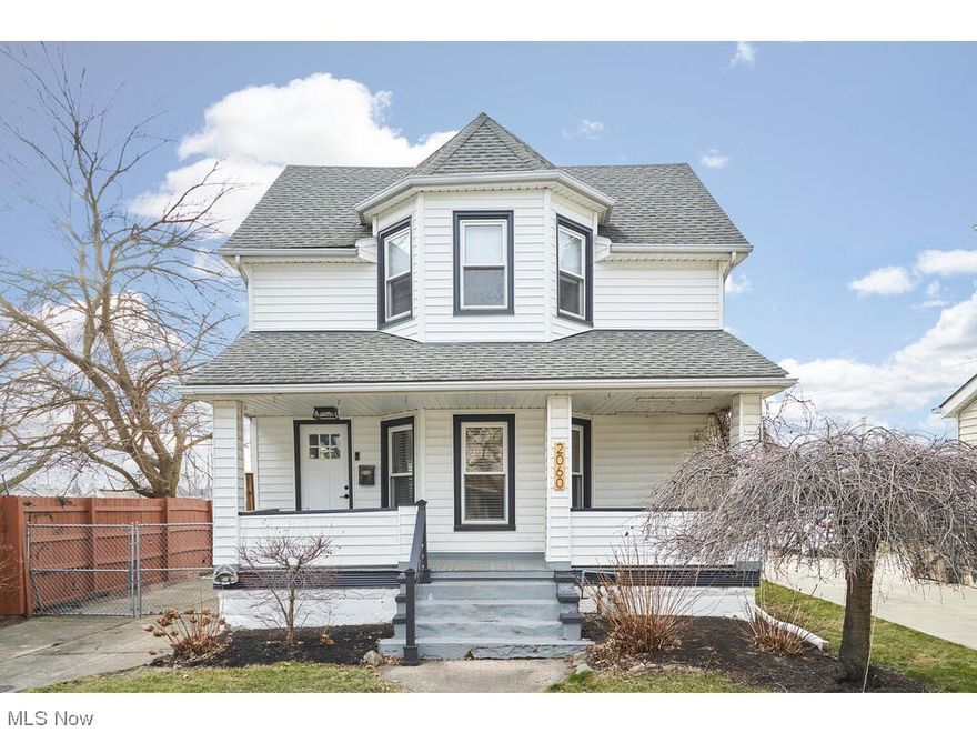 This stunning remodeled colonial home is located in Lakewood. From the moment you arrive, you will be captivated by the large, inviting front porch, newer roof and newer windows that bring tons of natural light into the home. Once inside, you are greeted by a beautiful front entrance that features wainscoting. The first floor features exquisite luxury vinyl tile flooring, new lighting, contemporary color palette. The spacious living room is bathed in natural light from the front bay window. Off of the living room is a beautiful half bath. Entertain guests in the elegant dining room with a sleek modern chandelier and a sliding glass door leading to the fenced-in backyard. The dining room is open to the kitchen. The recently remodeled kitchen is a chef's dream, showcasing soft-close cabinets, stunning marble countertops, subway tile backsplash, recessed lighting, & stainless steel appliances. Upstairs, you'll find three inviting bedrooms with newer carpeting & a fully remodeled bath with LVT flooring & a shower/tub combo. The backyard has been completely fenced and offers access to Madison Park. The shed has been recently renovated to include electricity and a bar for outside entertaining. The furnace was replaced in 2022.  No surface has been left untouched! It's conveniently located in the nationally registered historic district section of Lakewood called Birdtown—walking distance to parks,  shopping &  fabulous restaurants. There's nothing to do but move in and enjoy!