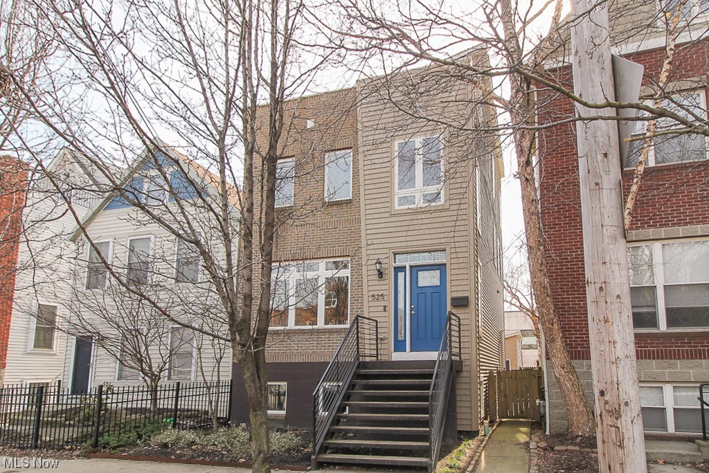 Located in the heart of historical Tremont, this beautiful townhome features an open floor plan and breath taking views of downtown Cleveland. The entrance welcomes you to an airy two story foyer leading to an open floor plan featuring inviting blond oak flooring throughout. The dining room leads to an open modern kitchen featuring granite countertops, cherry Shaker style cabinets, and stainless steel appliances. The kitchen includes a breakfast bar with wine rack and full pantry. The Great room with half bath is the perfect place to unwind with a gas fireplace and plenty of natural light. On the second floor you will find the master suite with walk-ins and luxury bath including jetted soaking tub and walk in tile shower. Second floor also includes laundry, additional bedroom and full bath. The third floor hosts the jewel of this home with a loft featuring new LVT flooring, full wet bar and refrigerator, that opens to a rooftop deck with expansive views of the Cleveland skyline. Home a