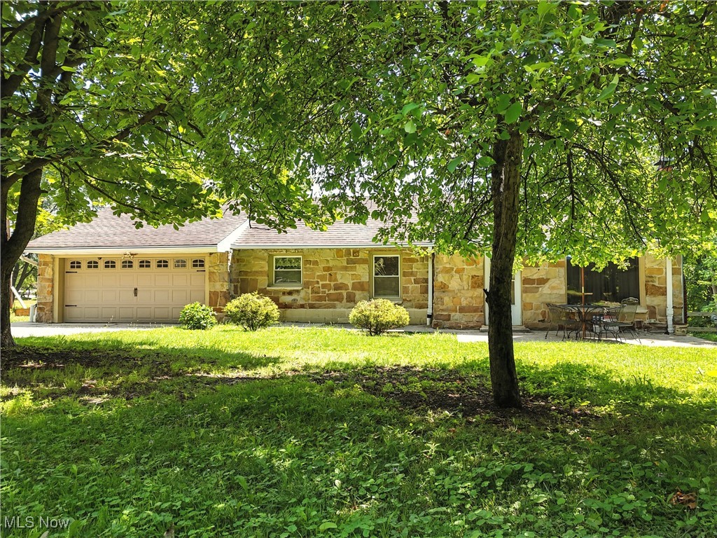 Truly One-of-a-Kind in Bedford Heights! This unique multi-level home offers endless possibilities with three levels of living space and three full kitchens and bathroom! The main floor functions as a complete ranch-style home featuring one bedroom, one full bath, a spacious living room, full kitchen and laundry area—perfect for single-level living. The second level (below) includes two additional bedrooms, another full bathroom, kitchen and living room—ideal for extended family, guests or income suite. The basement level offers another space with income opportunity with a third full kitchen, another full bath, and flexible space ready to be finished to your needs, with a walkout to the beautiful backyard. Sitting on .82 acres across two parcels, there’s plenty of outdoor space to relax, garden, or entertain. Whether you’re looking for a multi-generational living setup, income property, or just room to spread out, this home delivers. Conveniently located near freeways, shopping, dining, and tucked away on a quiet street with only a few homes!