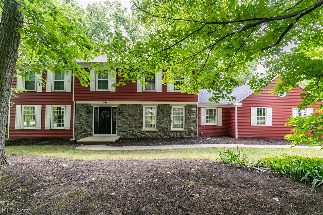 Welcome to this stunning colonial home in White Horse Acres! Step inside to the foyer with beautiful hardwood floors. A sitting room is on one side with nice big windows to let in natural light and charming built-in bookcases. The kitchen has been updated with lovely cupboards that accent the granite countertops and stainless steel appliances. Step over to the family room that has a darling fireplace and a sliding door that steps outside to the patio. There are 4 spacious bedrooms with newer carpet and 2.5 bathrooms. Also, do not miss out on the large private wooded area in the back of the house. Newer roof, windows and furnace.