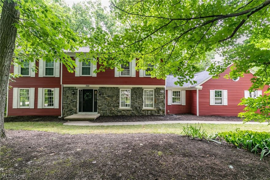Welcome to this stunning colonial home in White Horse Acres! Step inside to the foyer with beautiful hardwood floors. A sitting room is on one side with nice big windows to let in natural light and charming built-in bookcases. The kitchen has been updated with lovely cupboards that accent the granite countertops and stainless steel appliances. Step over to the family room that has a darling fireplace and a sliding door that steps outside to the patio. There are 4 spacious bedrooms with newer carpet and 2.5 bathrooms.  Also, do not miss out on the large private wooded area in the back of the house. Newer roof, windows and furnace.