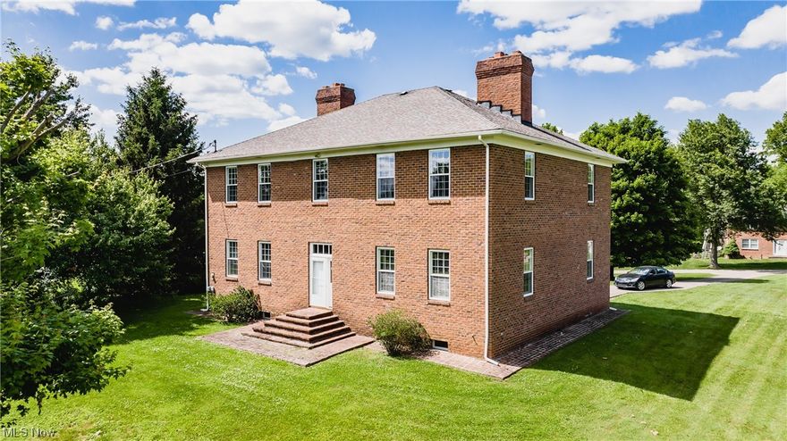 This house is a must-see for anyone who loves history, colonial architecture, and charm. It's a replica of the Williamsburg VA home of George Wythe, one of the signers of the Declaration of Independence. The house is located just minutes away from shopping, restaurants, the Ohio River, hospitals and is sitting on a large .9 acre flat lot. The home features a grand entry foyer with a stunning staircase, wood floors, 8 fireplaces, solid cherry cabinet in a fantastic kitchen, 3-4 bedrooms, 10 ft ceilings, central air, and hot water heat. The full walkout basement is equiped with a full eat-in kitchen, full bath and tons of storage space. The property is located outside the city limits and can lend it's self to many types of  uses and endeavors.