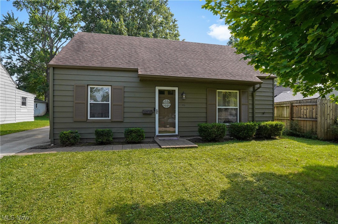 Welcome home to this charming Cape in the heart of Cuyahoga Falls. The living room is open to the kitchen and dining area. Kitchen offers refrigerator, stove/range, microwave, garbage disposal. Three season sunroom (new flooring 2024) is off of the kitchen and opens to fenced in backyard and offers a paver patio where you sit can out and enjoy or entertain. There are two bedrooms and bright, full bath (painted in 2023), with tub surround on the main floor. Upstairs you will find two more spacious bedrooms. Utility laundry room with washer and dryer. One car detached garage. New A/C (2024). Close to Front Street, shopping and restaurants and the Cuyahoga Valley National Park. Ready to move in!