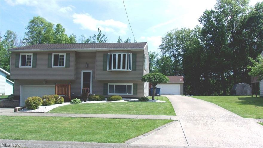 Spectacular 4 bedroom 2 full bath home on a quiet dead end street.  This house has a WOW factor!  The home is updated throughout and has been very well maintained. The first level boasts an open floor plan.  The updated kitchen has stainless steel appliances and moveable center island.  Beautiful bathroom vanity with granite counter. Three bedrooms on the first level and master bedroom with master bath is privately located on the lower level. Laundry room on the lower level.    Dinette area has doors that lead to a 2 tier deck and pool. The back yard is fully fenced with a wood fence that encloses a play area.  And if you like garages...you will definitely appreciate this property.  Along with the attached garage, there is also a separate concrete drive that leads to a 32 X 28 Heated garage complete with thermostat!  (Actually both garages area heated) Attic storage here too. There's even a refrigerator for the garage. And look at what's new: All new pool equipment, new sump pump, new garage openers for each garage, new ceiling fans, new HWT and roof was new in 2010! House has an attic fan and attic storage. Central AC.  The landscaping is breathtaking and the lawn perfectly manicured.  Entire property is very neat and clean inside and out! Including the garages :)