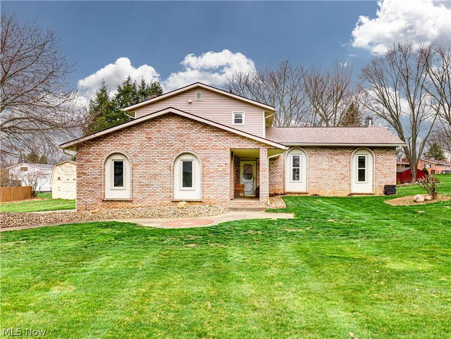 It is my pleasure to present 3881 Mahogany St. NW in Lake Township * Lake Schools * This beautiful 4 level split is located in desirable Hidden Knolls Estates *  Pride in Ownership * Spacious foyer entry with luxury vinyl tile * Off the foyer is an updated half bath, a main floor bedroom/office (it has a closet) and a first floor family room all with LVT * Family room features a raised hearth brick fireplace, beamed ceiling, and a patio door leading to deck * Second level features a generous sized living room and a spectacular kitchen both with LVT * This amazing kitchen was updated in summer of 2024 * Designed by Showcase Cabinetry, these custom made cabinets and drawers with soft close will surely please * Granite countertops * Quartz sink * Ornate subway tile backsplash * Full array of  LG stainless steel appliances * Center Island with seating for four (bar stools will remain) * Window seat * Large pantry with barn door * Bright bayed eating area * Ceiling fan, recessed & under cabinet lighting * The third level features a spacious master bedroom with two double closets & an ensuite full bathroom (new shower 2024) * Second bedroom has a large double closet * Third bedroom has a double walk in closet * Main bath features a bath/shower combo *  A linen closet & whole house fan complete the third floor * *Fabric blinds (2024) will remain * All TV mounts will remain * Basement features a recreation room with 2 closets, drop ceiling & LED panel lights * Laundry area complete with washer (~5 yrs) and dryer (~4yrs) * Storage area * Lennox HE furnace with AprilAire humidifier & an electronic air cleaner (2020) *Heil central air (2023) * Windows with transferable warranty (2018) * Glass block windows in basement (2014) * Roof & gutters/downspouts (2012) * Large 2 level shed and deck complete the backyard * Dog Watch underground fence (sellers are taking collar and control pad) *  Call your favorite Realtor today for a private showing;  trust me, you will be glad you did*