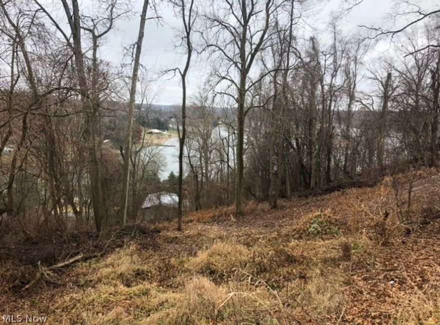 Two lots together in a great location, possible year round lake view and close to front gate! Huge double lot with 310 feet of road frontage. Build your dream home here! Lake Mohawk is a gated community having a 500 acre lake with unlimited horsepower, three beaches, golf course and tennis courts. Lake Mohawk is located 45 minutes southeast of Akron & 25 minutes from Canton. Enjoy summer and winter sports year round. One of Ohio's best kept secrets!!!