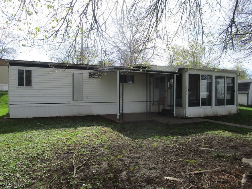 Call your Agent !! Super clean, well maintained and move in ready! Don't miss this 2 bedroom mobile with an adorable kitchen featuring butcher block counters and a sunny dining room with plenty of built-ins for your extra kitchen items. Enjoy morning and evening snacks and beverages on the breezy sunporch - prior tenants also used it in the winters since it heated easily by opening a LR window. There's also a 13x10 concrete patio, just perfect for your picnic table and grill! Nice sized living room- 2 bedrooms - a full bath with a handy step-in shower!... all on one floor - all on a quiet secluded lot. Sellers are including the stove, fridge, washer and dryer, along with the handy 11x10 shed, which has electric and a small storage loft area. Additional features include the updated electrical panel and a handy closet in the living room for extra coats and storage. Taxes are unbelievably low, at 29.00 per year. Parkwood Village offers a clean, well kept park with a peaceful rural vibe. Wind through the curving streets, past the tranquil pond with its floating geese and enjoy the mature trees scattered throughout. This spot is just minutes from Route 11, Route 84, shopping, fine dining, Lake Erie, historic Bridge Street, medical facilities, parks, beaches, wineries and more. Management must approve all buyers in this established 35+ years park. Ask your Agent for the forms, rules, regs, etc that are provided in the supplements section. Current rent is 269.00 per month. See the supplements for charges for pets, and discounts for seniors, in the supplements section.There are a few pet restrictions. Residents pay their own water, sewer, heat, electric and trash. Residences must be owner occupied; no renting, leasing or sub-leasing is permitted.This is a 1971 Buddy, Model CL60122BFDRAS, Serial # BE2625E. If you don't have cash and need a loan, the Listing Agent can provide contact info for a few potential mobile home lenders - have your Agent reach out!.