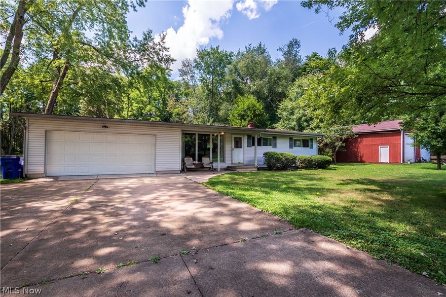 Welcome to 1363 Rhodes Ave. This lovely ranch-style home sits on 1.42 acres of land, featuring two bedrooms, one full bath, 1,008 square feet of living space, and a full basement below. Walking through the home you will see vaulted ceilings throughout, as well as a large picture window looking out to a beautiful, large tree in the front yard that provides tons of shade! This home has so much to offer including, loads of potential, a fenced in portion of the backyard, plenty of parking with the extra wide driveway, the attached two car garage, AND the 54x32 barn next to the home!! The barn is perfect for enclosed storage for an RV or any recreational vehicle, it can also provide a great place to keep any lawn care or construction equipment, or could be used for anything your heart desires! It could also be rented out to someone looking for enclosed storage! The barn has 14ft high ceilings and 12ft tall garage doors, which makes for plenty of head room! 1363 Rhodes Ave has so many great