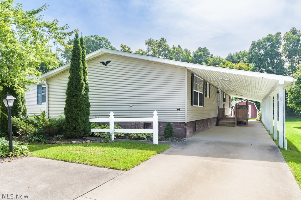 Welcome and WOW to the Tranquil Troy Oaks community. Beautifully maintained Fall Creek manufactured home with spacious open concept floor plan. Kitchen and great room are in the center of the home. Kitchen boasts center island, plenty of cabinets, large eating area and is open to the great room with trimmed out walls. The left wing of the home has the dining room, glass French doors to the gorgeous living room featuring a wood burning stone fireplace, built ins and a ceiling fan. The owner’s suite has two closets (one walk in), jetted tub, walk in shower and double sink vanity with tumbled marble counter and backsplash. The right wing of the home features two bedrooms, full bath and large laundry room with counter space, shelves and lots of cupboards and storage. Crown molding and trim throughout. There is a large shed in the backyard for storage. The driveway and parking pad can easily accommodate three cars. A stone’s throw from Lake LaDue that offers several recreational opportuniti