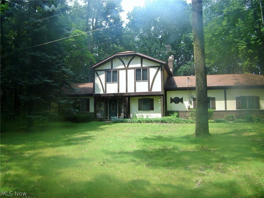 This is the home you have been waiting for – a wonderful wooded hideaway on 5+ acres, with barn. You will find this three-bedroom, three-bath colonial in a beautiful wooded setting so secluded you will have to follow the signs to find it!  Inside you will find a large kitchen adjacent to a lovely family room with wood burning fireplace and stone hearth. The family room walks out to a secluded, covered patio overlooking the woods. There are spacious rooms throughout the home with beautiful views of the surrounding woods. And there is a handy office on the first floor as well as a first floor laundry room.  The home also offers an attached 2.5-car garage and an Amish-built, two-story barn that is 32 x 40. It is divided with one side set up as a workshop complete with concrete floor, electric and work benches. The other half has stall space and a dirt floor to accommodate livestock. There is a second-floor loft over both sides that could be additional work room or hay storage. We invite y