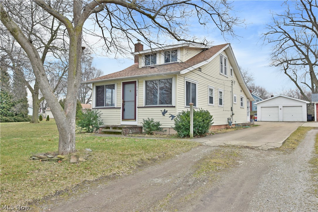 Tons of potential is waiting to be unlocked with this fantastic lakeside property! Looking out over Lake Shore Park, this charming residence puts you up close and personal with Lake Erie’s relaxing beaches and stunning views. Inside you’ll find a surprisingly spacious, three-bedroom layout; featuring a lower master and offset upper living spaces. Through the front door, the extended foyer doubles as a sunroom as natural light pours in through the front windows. French doors lead to the carpeted living room where a fireplace rests below a brick mantle. The main hall leads past the master bedroom while offering additional closet space. A full bath completes the hall as it opens into the robust kitchen. Entrance ways can be found at either side, with the nearer bestowing basement access where laundry and utilities are located. A two-car detached garage offers plenty of storage, while garden space sits adjacently.