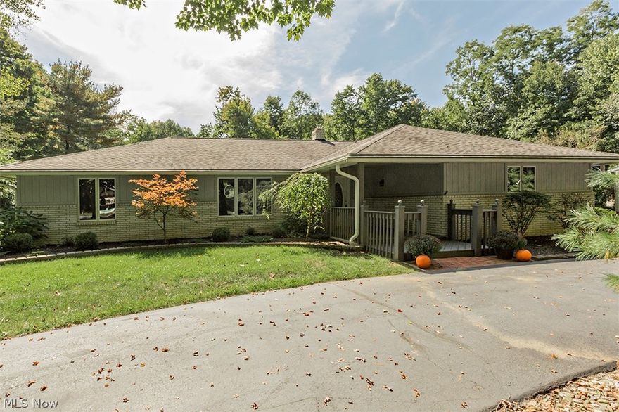 One floor living in great Willoughby Hills location. Spacious Ranch. Added bonus: city water & sanitary sewer! Covered front porch leads to tiled entry foyer. Living & dining rooms across the front overlook wooded front yard. Bright family room with raised hearth fireplace, wet bar and sliders to deck. Large, eat-in kitchen with plenty of cabinet & counter space. Master suite has private bath, walk-in closet. 3rd bath is off kitchen. Circular driveway. Beautiful 1 acre lot. Furnace & central air were installed in 2016.