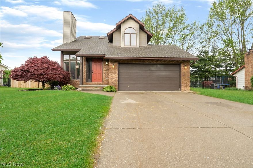Welcome to this incredible 3 bedroom 1.5 bath home located within close proximity to the beautiful Portage Lakes State Park! Upon entering the home you are greeted by tall cathedral ceilings and tons of sunlight streaming in through the large windows. The gas fireplace in the living room creates a cozy atmosphere while enjoying a restful evening indoors. Laminate wood flooring and neutral decor flow throughout the home making an easy transition for nearly any decorating style. Enjoy entertaining your guests in the open kitchen and dinette with abundant counter and cabinet space, glass tile backsplash, stainless steel appliances, and a breakfast bar. More cabinet and counter space in the dinette would be ideal for an at-home workspace or coffee bar. Sliding doors off of the dinette will lead you to the large deck with a full wrap-around railing ideal for pets and kids. Conveniently located half bath and laundry room complete the 1st floor. The 2nd-floor houses all 3 bedrooms including t