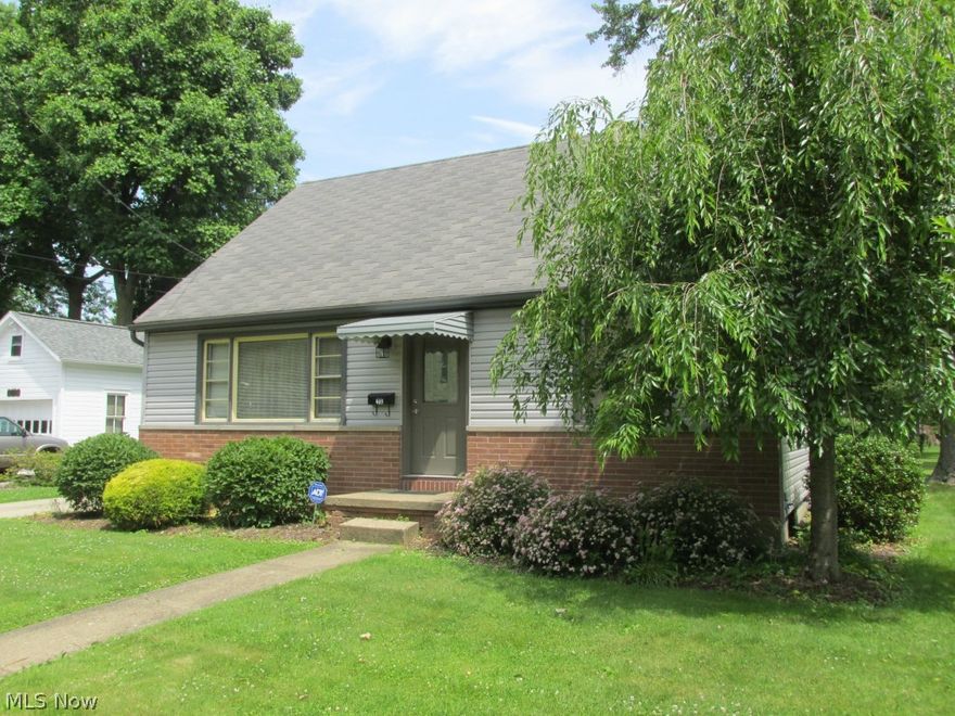 Brick & vinyl 1.5 story home with large 2 car garage.  First floor master bedroom, family room with fireplace, cement drive, shower in basement, fully applianced, A/C.   Stove in basement stays.