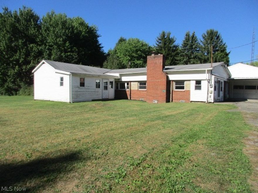 Country setting & close to Berlin lake.  3-4 bedroom ranch home with full bath & wood burning fireplace.  Large 2 car attached garage w/ extra storage , workshop & wood burning furnace.