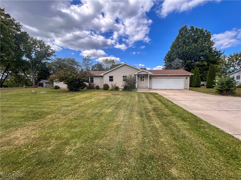 Looking for a RANCH with a 2 car attached garage, a huge private back deck, a wide concrete drive, boasting over 2000 square feet of living space, a massive partially finished basement, sitting on almost 2 acres of peaceful quiet private property priced below market value....... look no further, you just found what you've been searching for. This sprawling, meticulously maintained, fantastic home must be seen in person to truly appreciate. You will fall in love with the large Family Room/Living Room combination with a great fireplace and custom built in library perfect for entertaining and private nights alone. The large kitchen with island is also a huge plus along with the massive eating area. The bedrooms all offer plenty of space as well more than ample closet space for storage. You MUST SEE the basement and witness for yourself all the options it provides for whatever your wish list may entail. A massive back deck is perfect for privacy and entertaining and the convenient extra she allows for even more necessary storage. The home also comes with a seller provided one year home warranty for a worry free purchase. All appliances convey (except the stand up freezer in the basement) Call today for a private showing.
