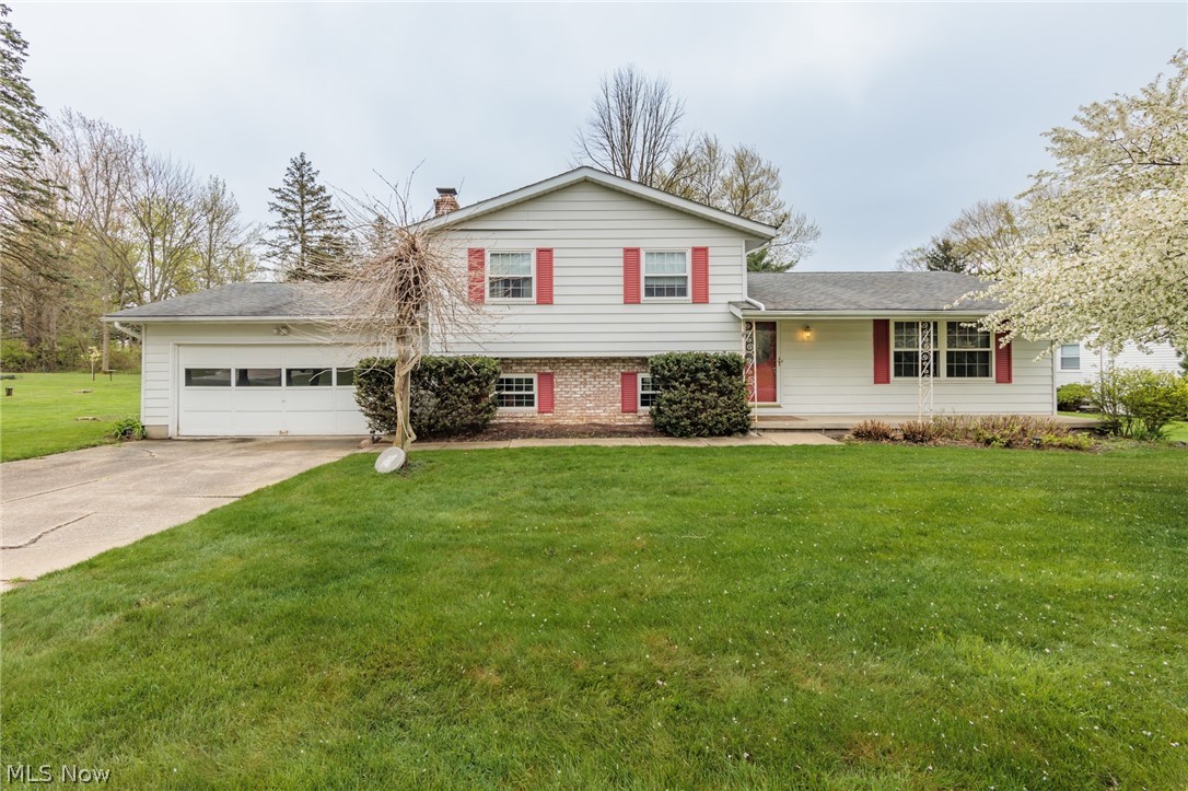 If you are looking for an affordable home in Hudson, look no more! This 4 level split has 3, possibly 4, bedrooms. A little bit of cosmetic updating and this home will be amazing. The .55 acre lot is private, and can be enjoyed from the front porch, or rear patio. A large family room has a cozy fireplace, and there is a bonus room on the lower level. The large basement is perfect for a gym, or to be finished for even more space. An eat in kitchen, formal dining, and formal living room make up the first floor. The bedrooms are ample sized, with large closets. Do not miss this rare opportunity.