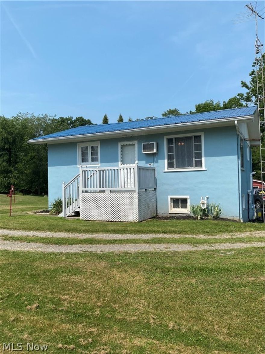 Check out this little blue cutie! Located on a secluded drive where you can enjoy the peaceful .71 acres and have access to Sandy Creek. One stall attached garage, two stall detached garage with a work shop and an additional two stall oversized detached garage. Updated electric (200 AMP) and New AC 06/21 . Cement in back 2020. New metal roof in 2015. Exterior paint in 2018. Fantastic investment potential. Quiet neighborhood and last house on a dead end street!