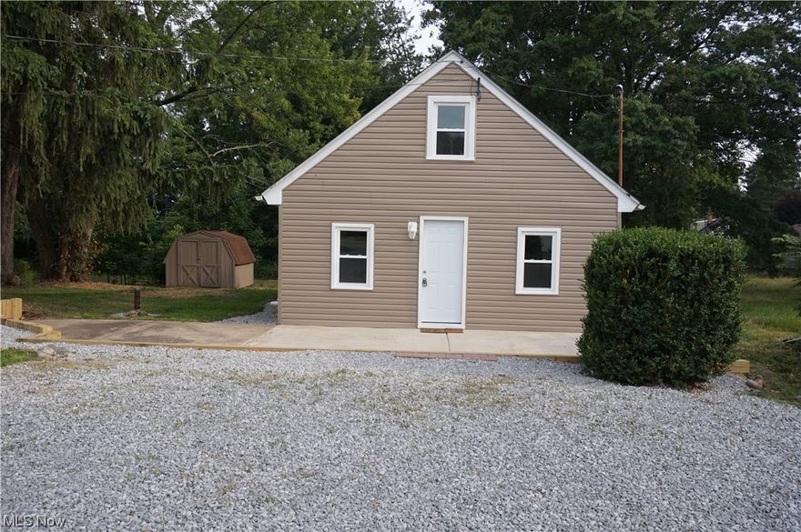 This charming bungalow has been freshly renovated and is ready for new owners! Walk through the front door into the spacious living room with an abundance of windows that give this room a warm, welcoming feeling. The kitchen features new cabinetry, butcher block countertops, tile backsplash, and a new range and microwave. There's a raised bartop to enjoy your morning coffee and plenty of room for a dining table. Luxury vinyl tile flows throughout the main level including the first floor bedroom and bathroom with new vanity and bathtub/shower combo with tile surround. The second level offers additional living space and a generous sized bedroom with LED recessed lighting. Brand new windows, furnace, central air, and hot water tank. There's plenty of outdoor space and a 10x16 shed for your storage needs. Call today to schedule a private showing!
