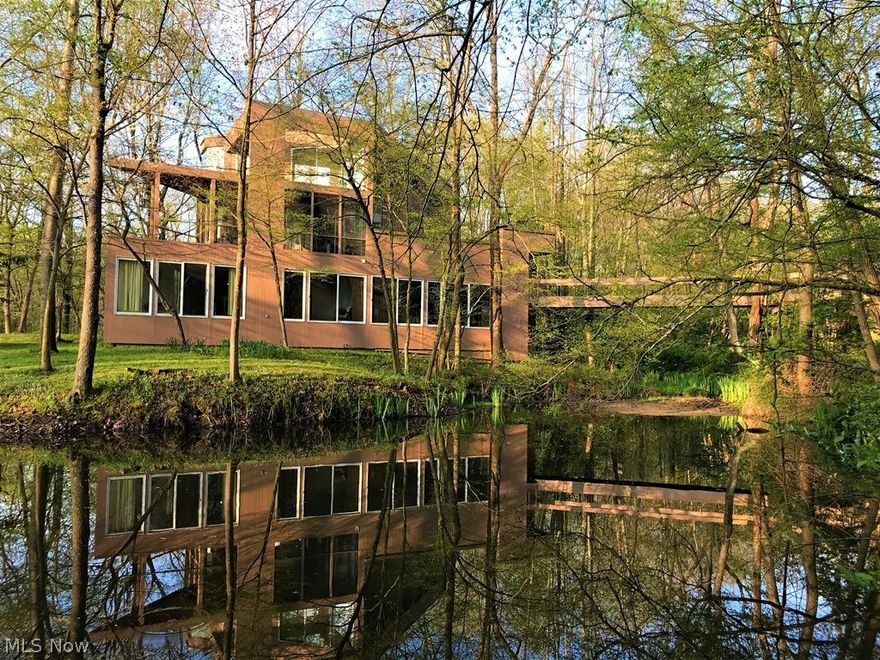 TOTAL SECLUSION!  Become one with nature in this Frank Lloyd Wright inspired home, designed by architect Julius Blum & built by local builder, Mike Andorfer. 10170 Liberty Chapel Road, just west of Mount Vernon, off SR 229 - easy commute to Columbus, Mansfield, Cleveland via I-71 - 35 minutes to Polaris; 4 BR, 3 Bath, 5031 square feet; 10 Acres, pond, stream. Virtually every room on 3 levels has lots of glass letting nature come right in. Made to entertain...inside and out. Also, walkout fourth level for mechanicals, storage, including climate-controlled wine cellar. Wow your guests as they enter the home by way of the walkway bridge over the stream that feeds the pond. The high-end appliance-filled kitchen will sure to delight. Drop-dead gorgeous master suite with huge walk-thru closet. Exercise room with pond & nature views, sauna & walking trails add to the heathy lifestyle. Zoned heating & cooling, gas powered whole house generator, alarm system. Most furniture negotiable. Present