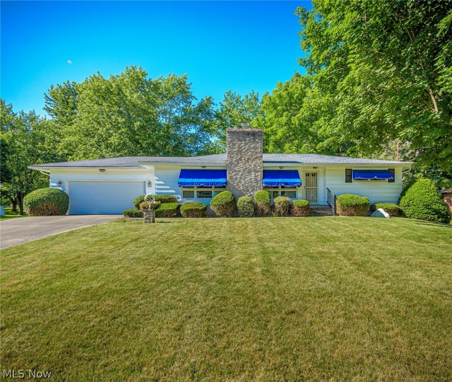 Lovely Ranch situated on 1.8 acres and includes one 2 car attached garage and one detached 2 car garage. Well loved and maintained in excellent condition for many years. Extra deep concrete driveway affords plenty of room for parking . The foyer entry leads to the elegant formal living and dining rooms with neutral decor, crown molding , decorative columns and a full wall stone gas fireplaced. The kitchen is in pristine condition with the beautiful original wood cabinets, a built in breakfast bar and ceramic tile floor. There's wood trim and hardwood floors under the carpets and leading into the 3 bedrooms. The basement has a nice sized finished rec room and a full second bath. Washer and dryer included. Home Warranty too. Must see.