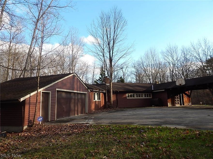 Rustic contemporary home sets way back from the road on .... 6 wooded rolling acres. Mid century modern style with many updates but could use loving restoration. Features 3 bedrooms and 4 baths. Vaulted great room with wood burning fireplace. 3 parcels make up the acreage. Large outbuilding. perfect for workshop or car buff. Seller had Summit County Inspection done on septic and well and will replace septic as required. Diamond in the rough with endless possibilities. Partially finished walk out basement. 2 car attached garage and front carport.